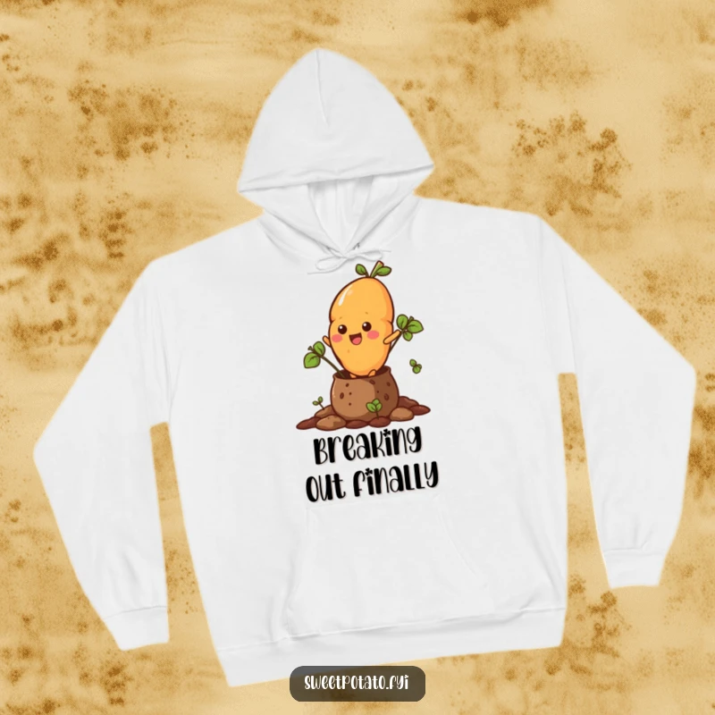 Funny hoodie depicting a sweet potato character forcefully emerging from a soil pot, full of vigor.