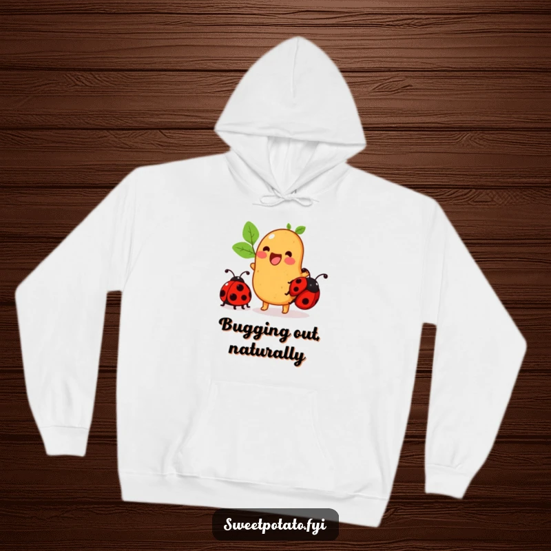 Funny sweet potato hoodie featuring a character excitedly trying to ride a ladybug, perfect for cozy, humorous wear.