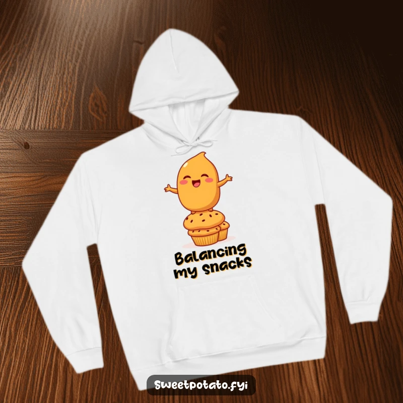 Funny Hoodie: A comfortable hooded sweatshirt displaying a laughing sweet potato character balancing on a stack of muffins, radiating playful silliness.