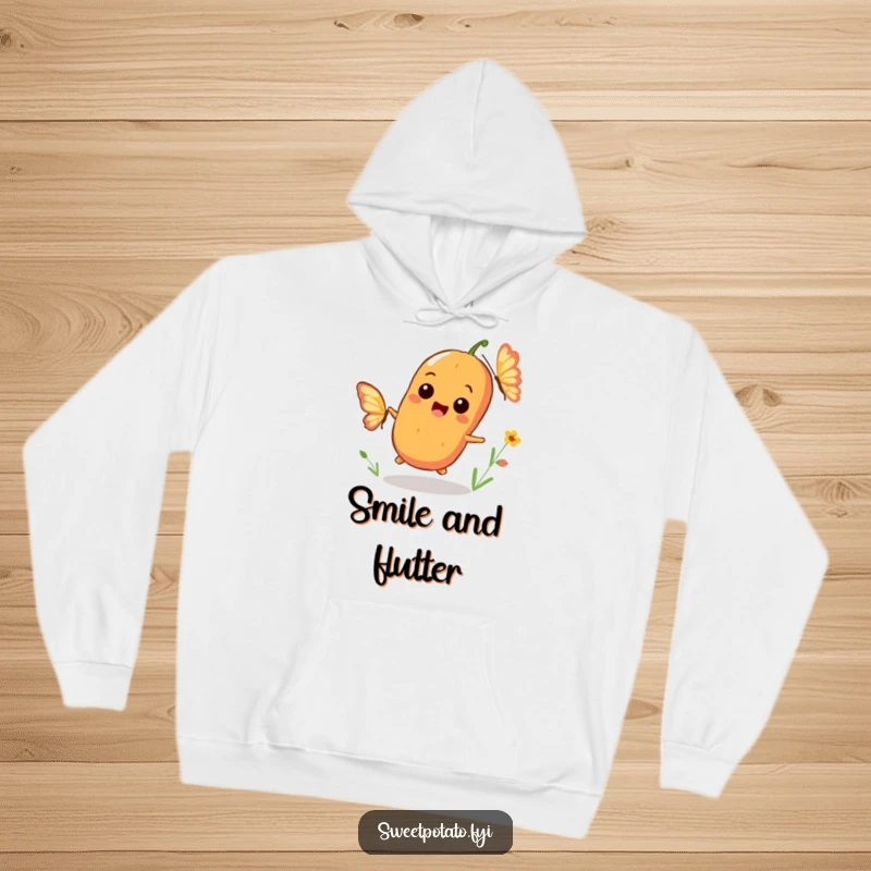 Funny hoodie featuring a playful sweet potato character smiling widely while chasing a fluttering butterfly, perfect for cozy, joyful wear.