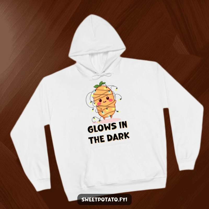 Funny hoodie showcasing a sweet potato character comically ensnared by a string of glowing fairy lights, exuding a playful and warm vibe.