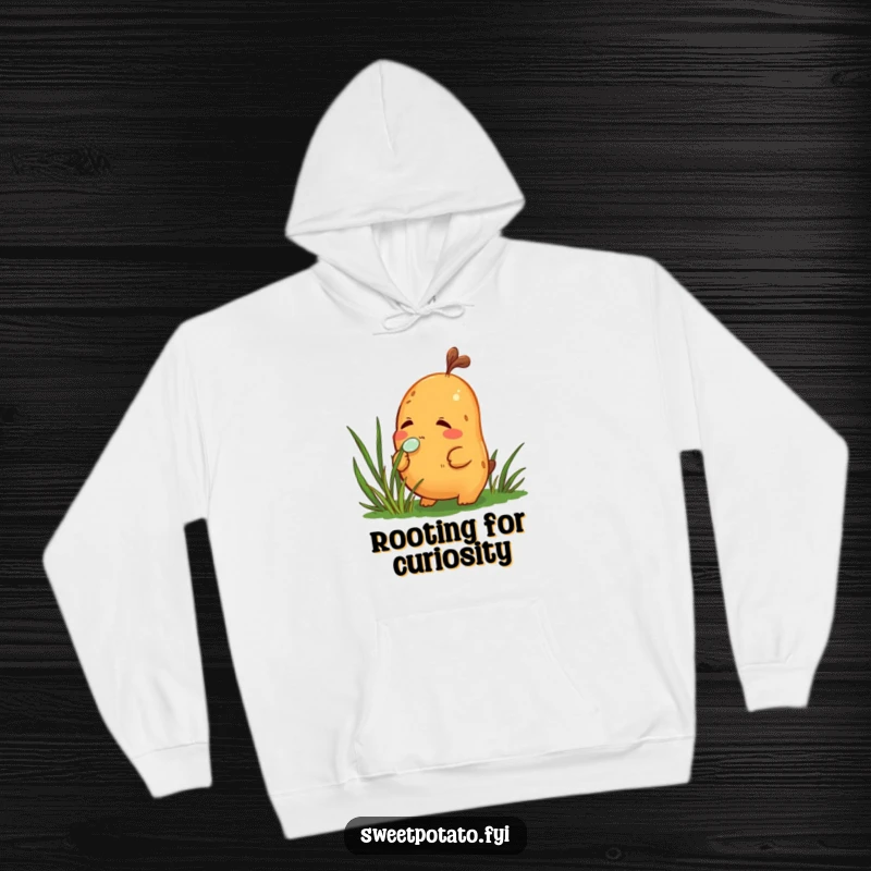 Funny hoodie featuring a curious sweet potato character sniffing a dewdrop on grass, perfect for cozy, thoughtful wear.